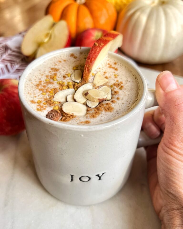 caramel apple protein smoothie in a mug with toppings