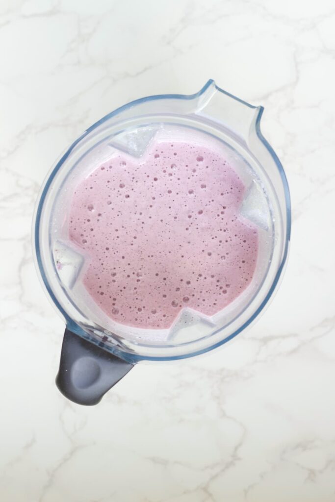 blueberry protein shake blended in a blender