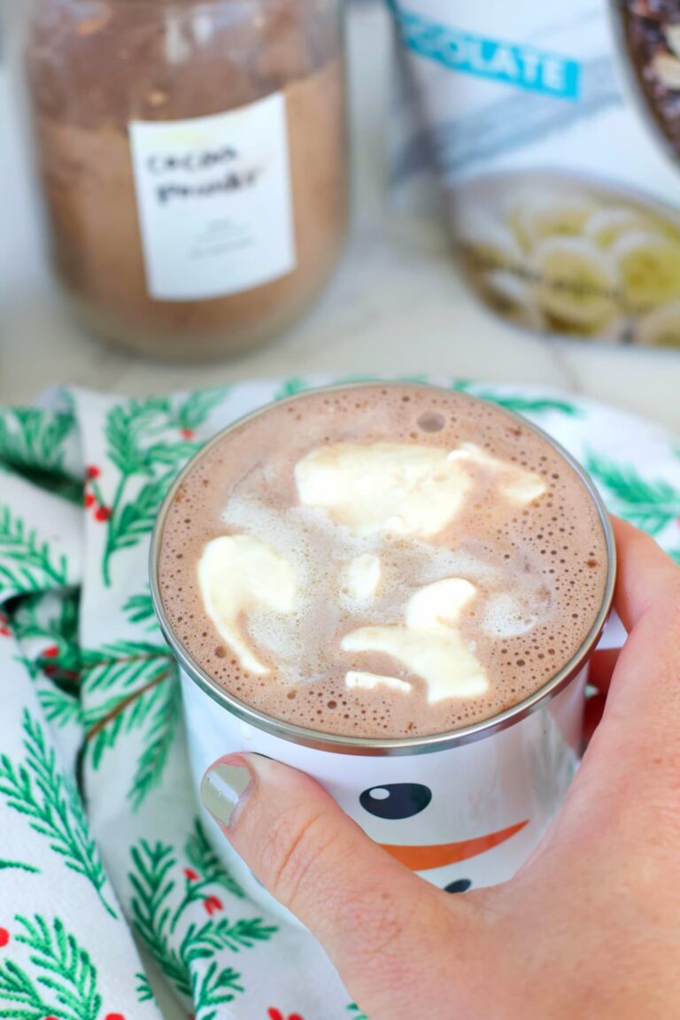 peppermint protein hot chocolate in a mug with whipped cream
