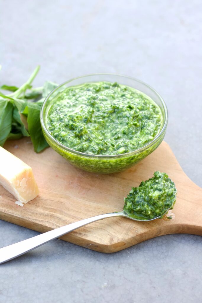 pesto without pine nuts in a bowl and on a spoon