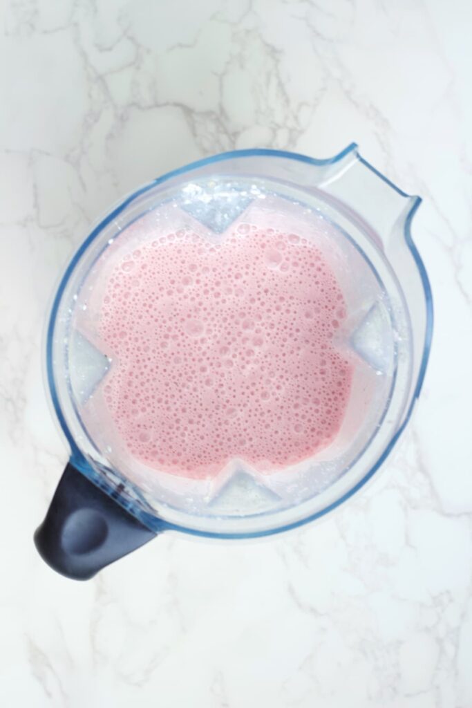 strawberry cottage cheese smoothie blended in a blender