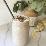 chocolate almond butter smoothie with cacao nibs on top