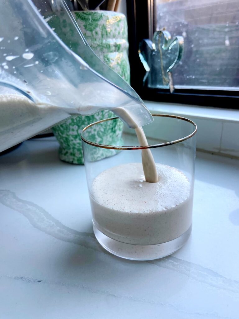 cinnamon roll protein smoothie being poured
