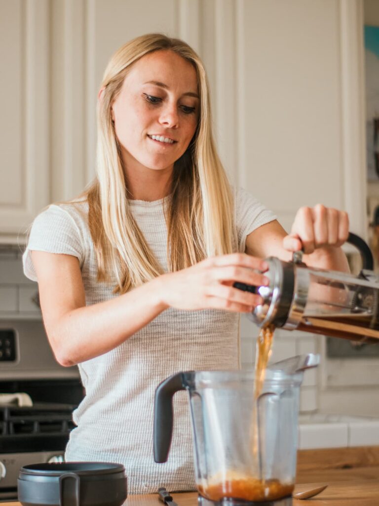 autumn pouring coffee from french press