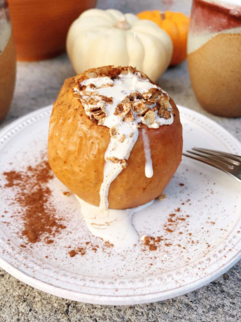 baked apple with heavy cream on top