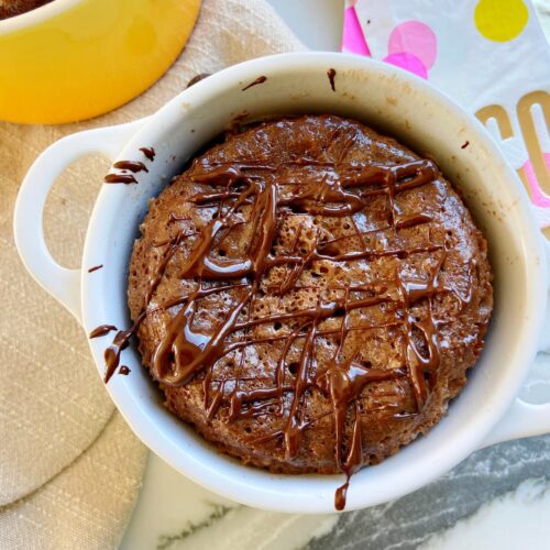 brownie protein mug cake with chocolate drizzle