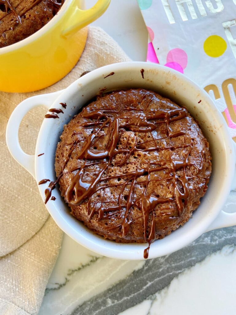 brownie protein mug cake with chocolate drizzle