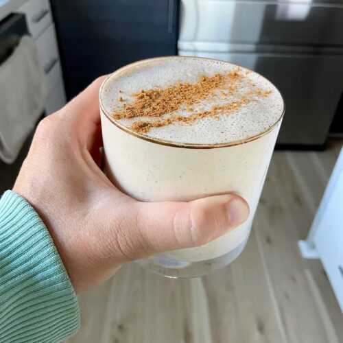 cinnamon roll protein smoothie in a glass