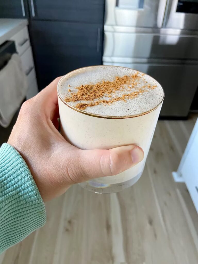 cinnamon roll protein smoothie in a glass