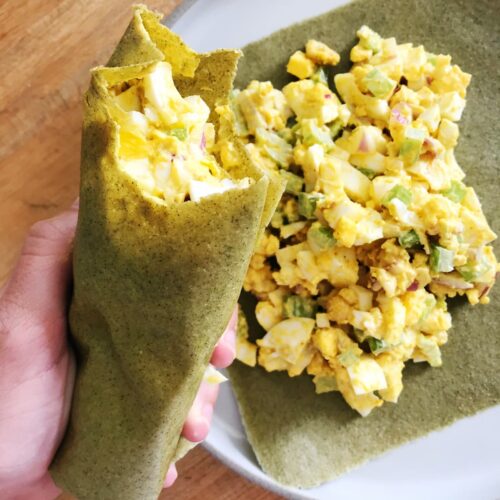 curry egg salad wrap held up