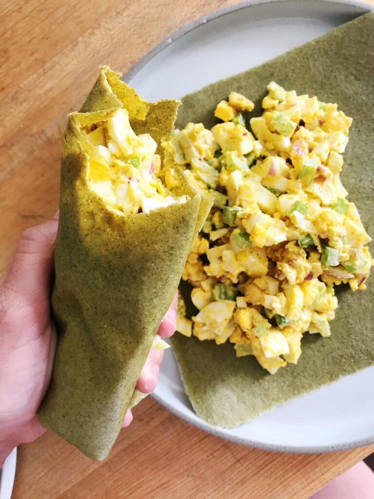 curry egg salad wrap held up