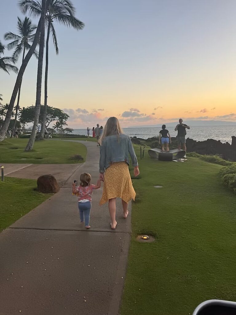 woman and her daughter walking