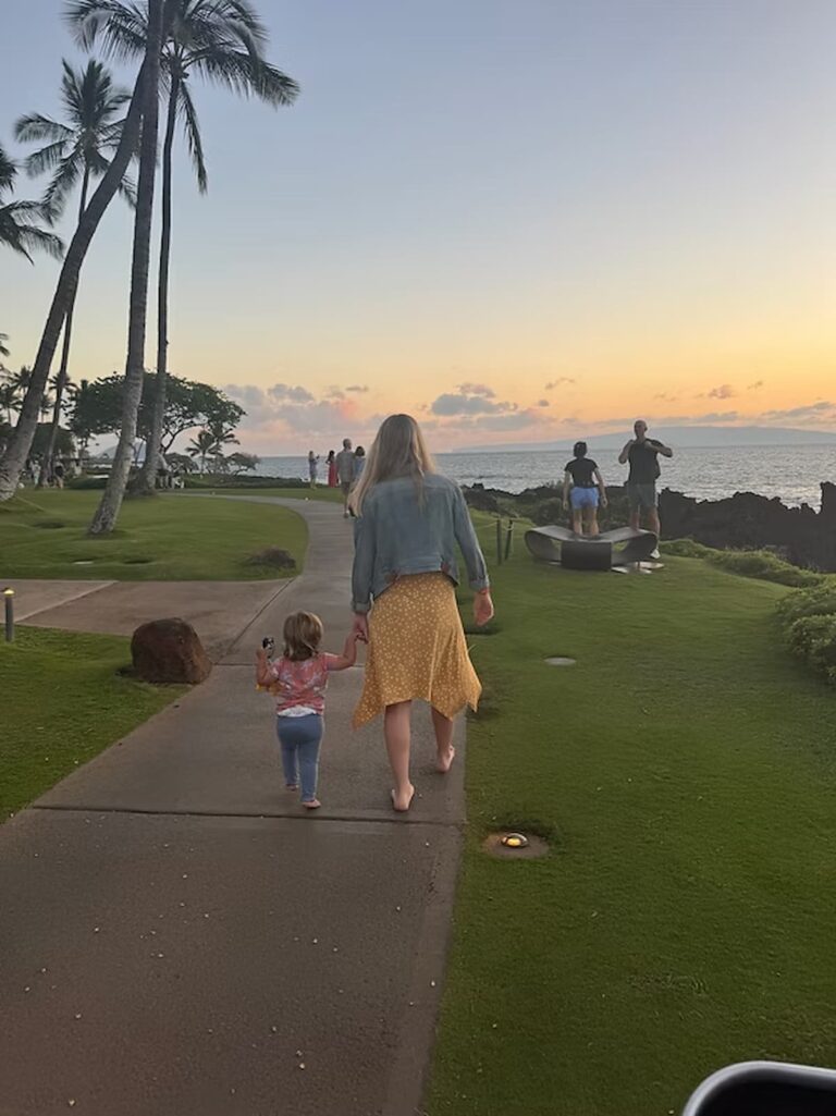 woman and her daughter walking