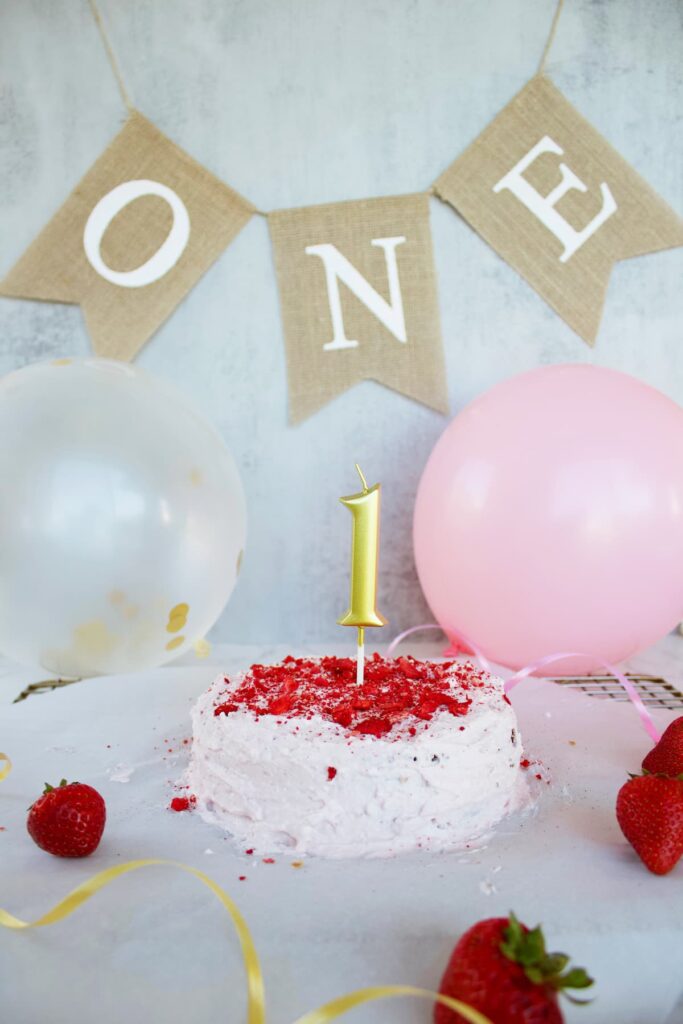 healthy smash cake with birthday decorations
