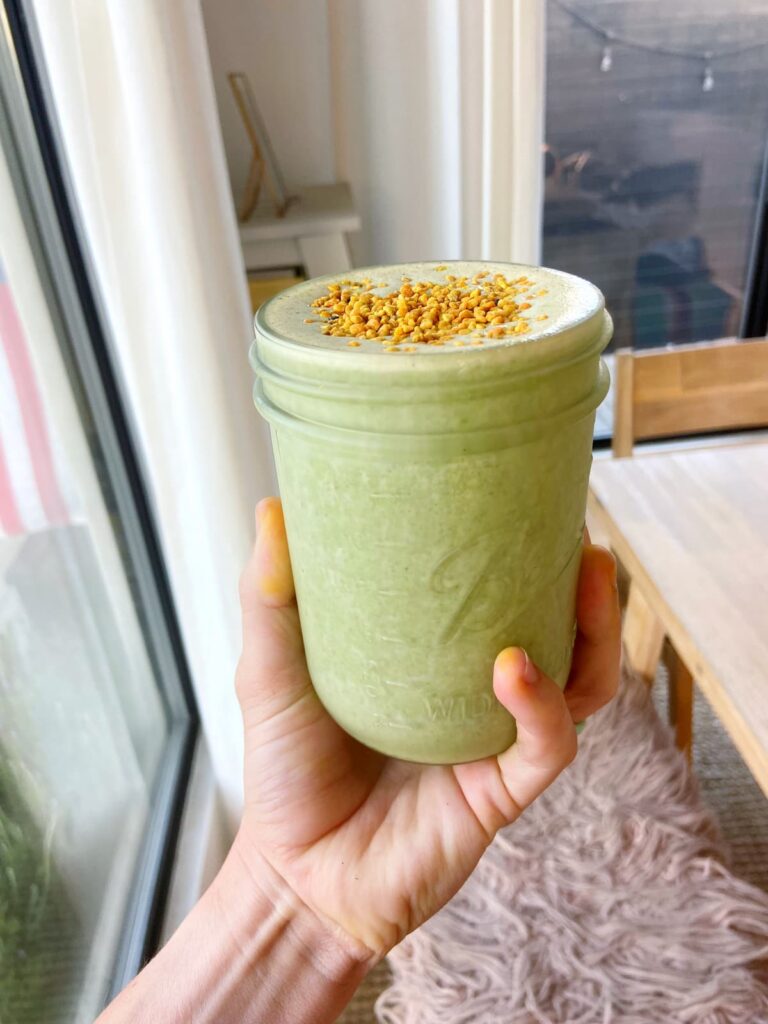 green protein smoothie with bee pollen on top