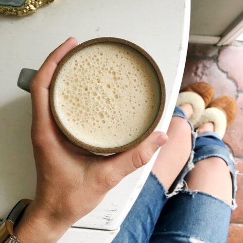 keto coffee being held on a white table