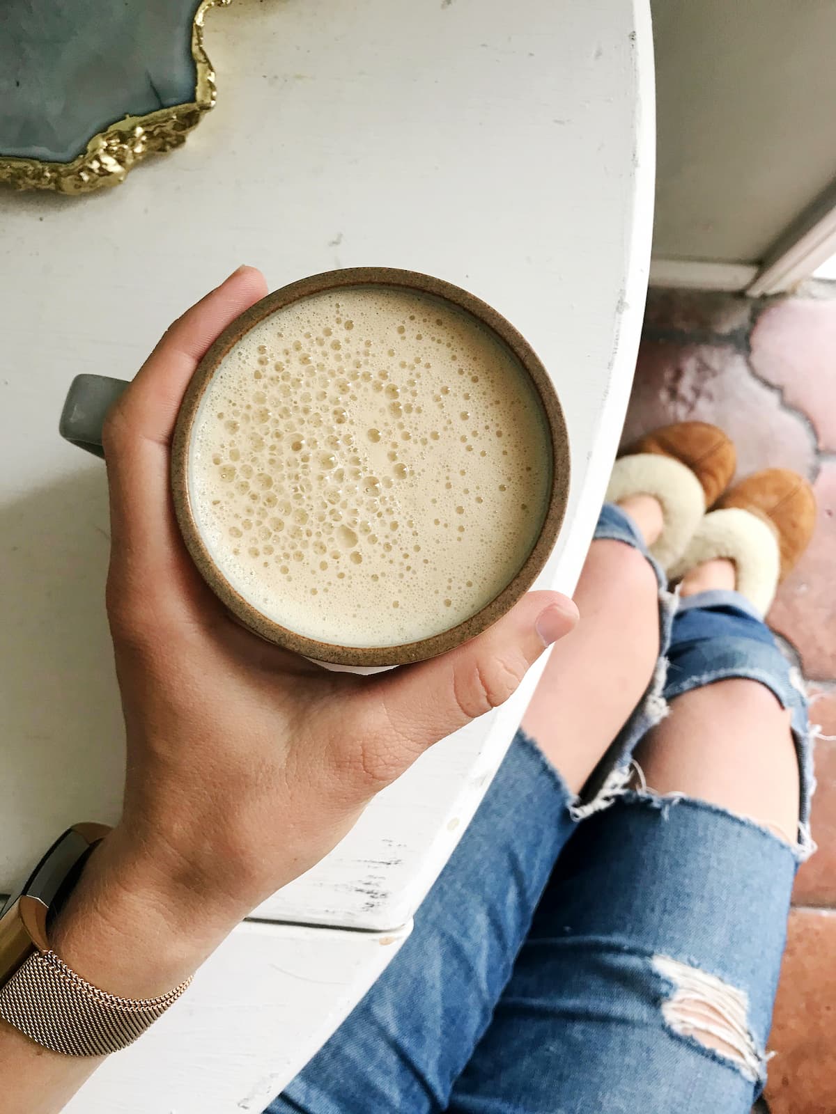 keto coffee being held on a white table