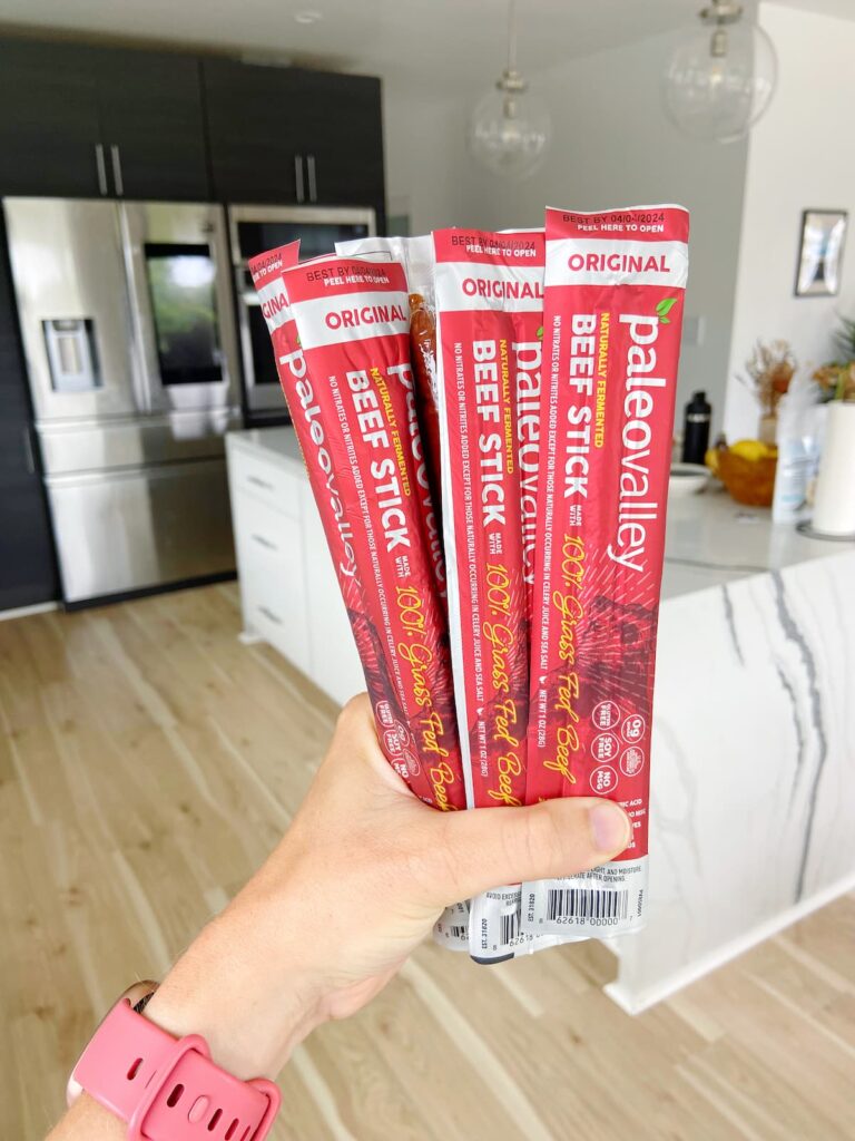beef sticks held up in a kitchen