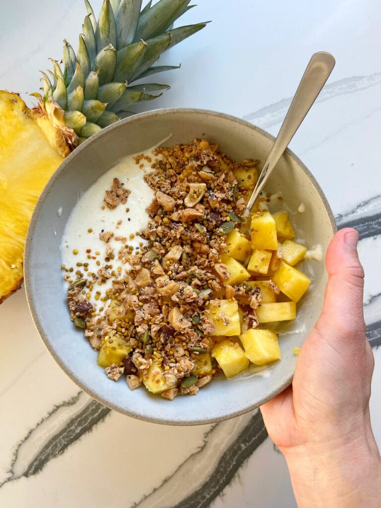 pineapple and grain-free granola greek yogurt bowl