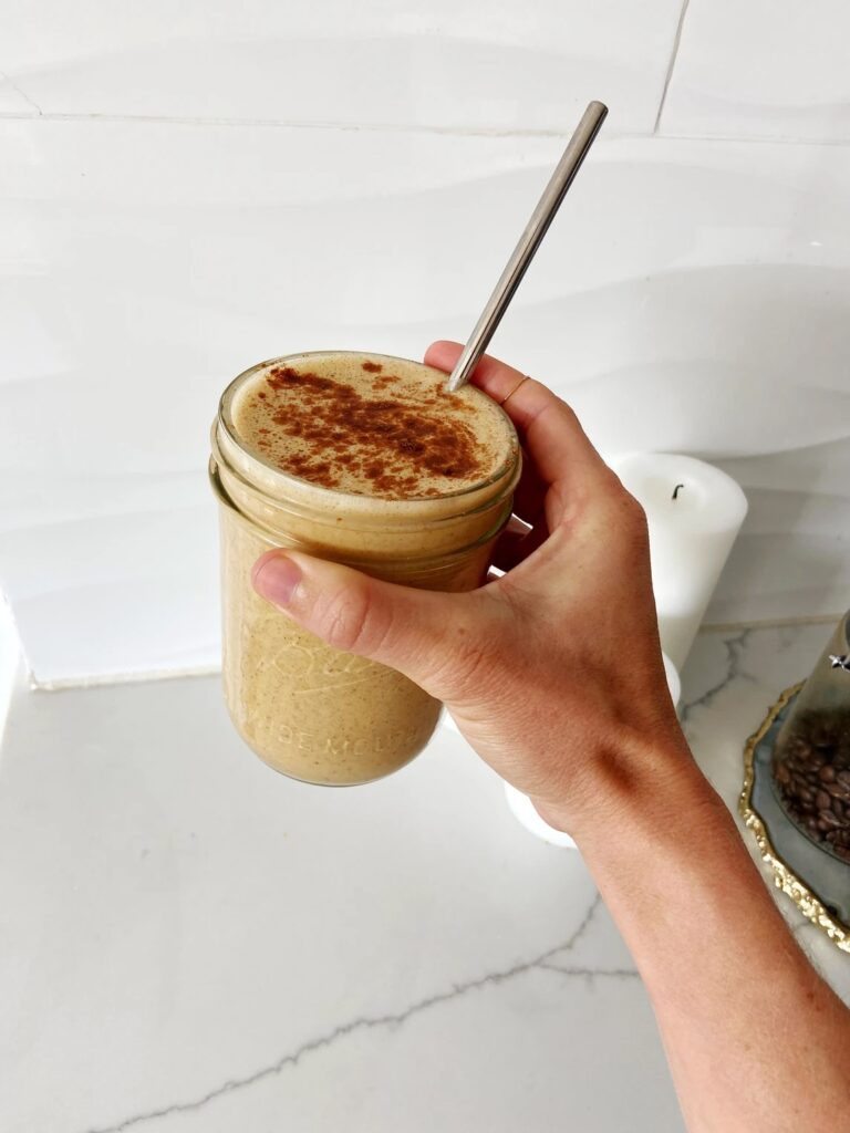 pumpkin spice latte protein smoothie in a glass