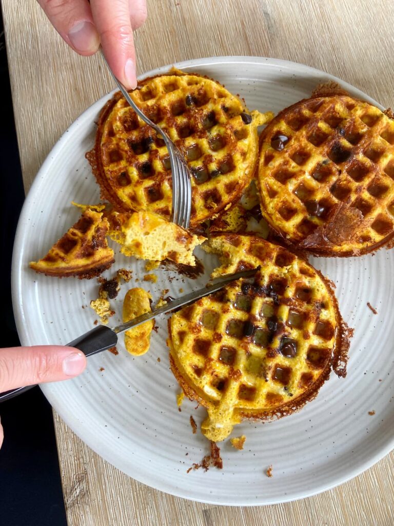 pumpkin spice protein waffles being cut into