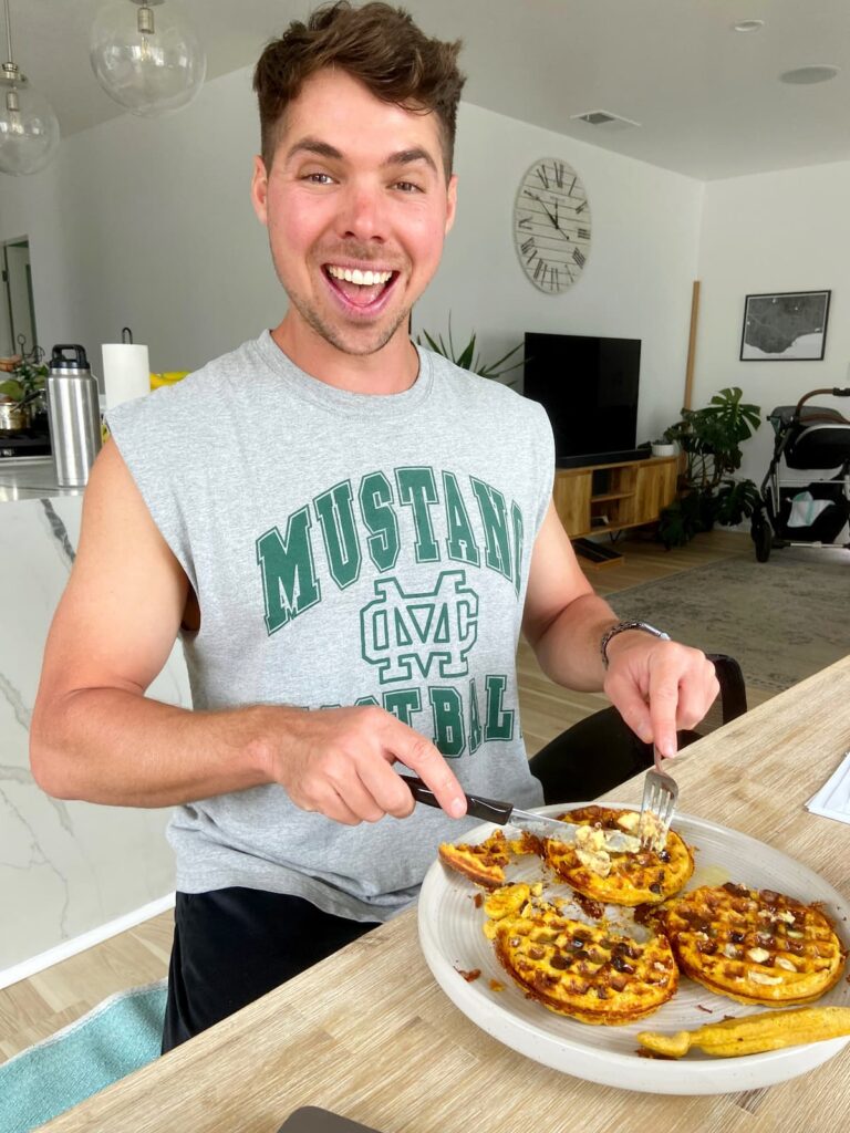pumpkin spice protein waffles being eaten by a man