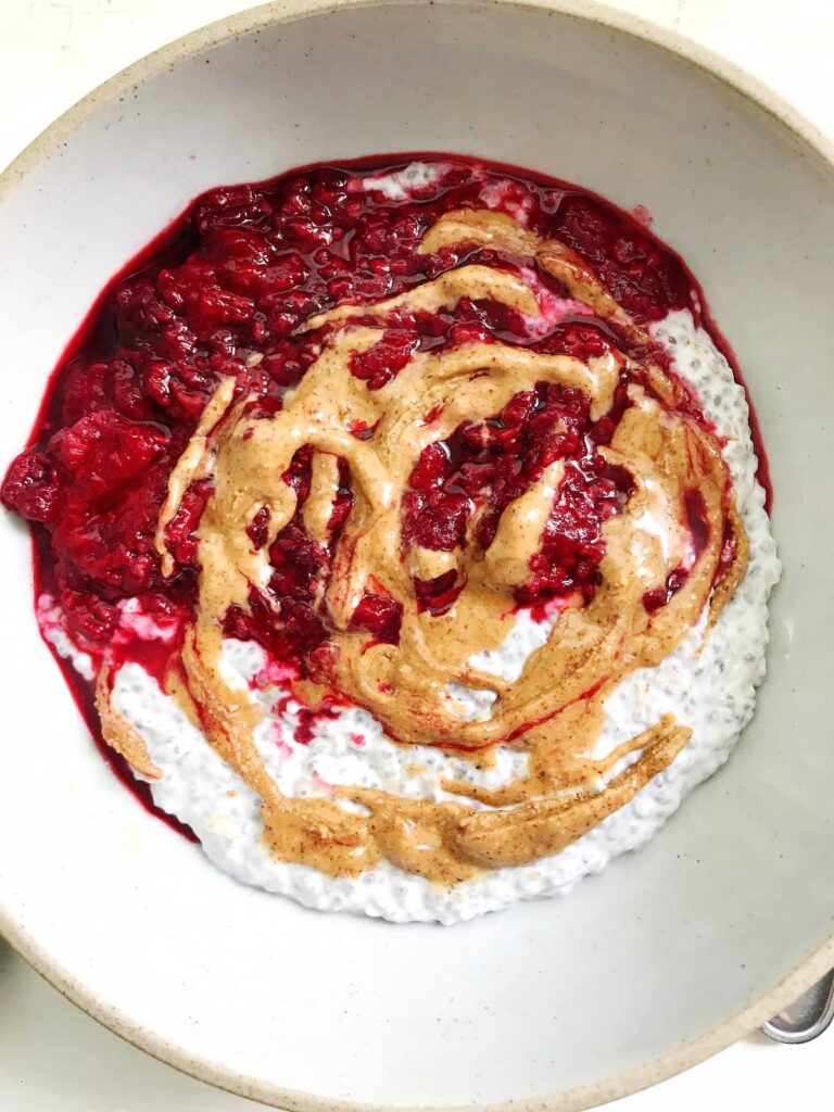 raspberry and almond butter chia pudding in a bowl