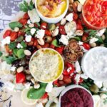 roasted beet dip on a platte with veggies and other dips