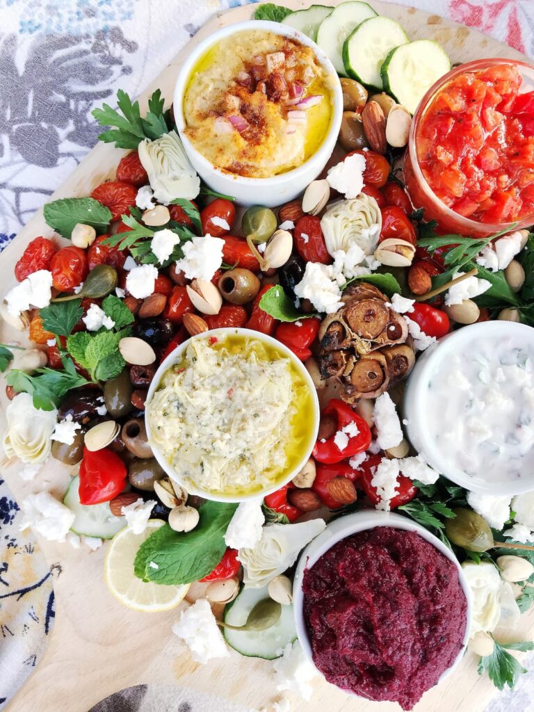 roasted beet dip on a platte with veggies and other dips