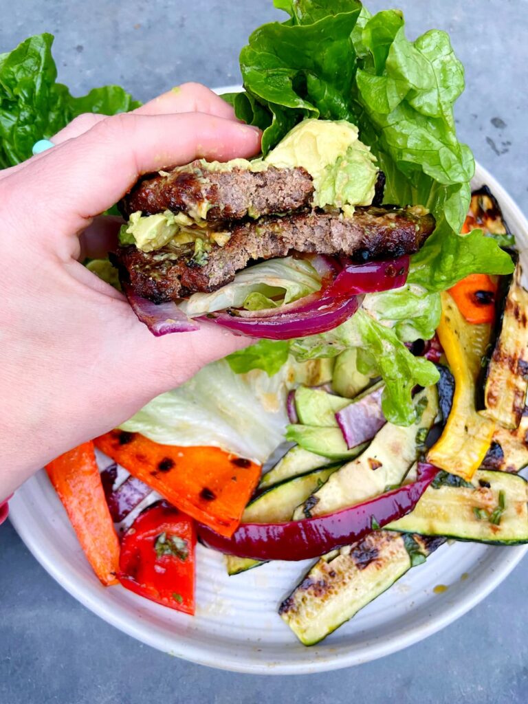 lettuce bun burger with avocado topping