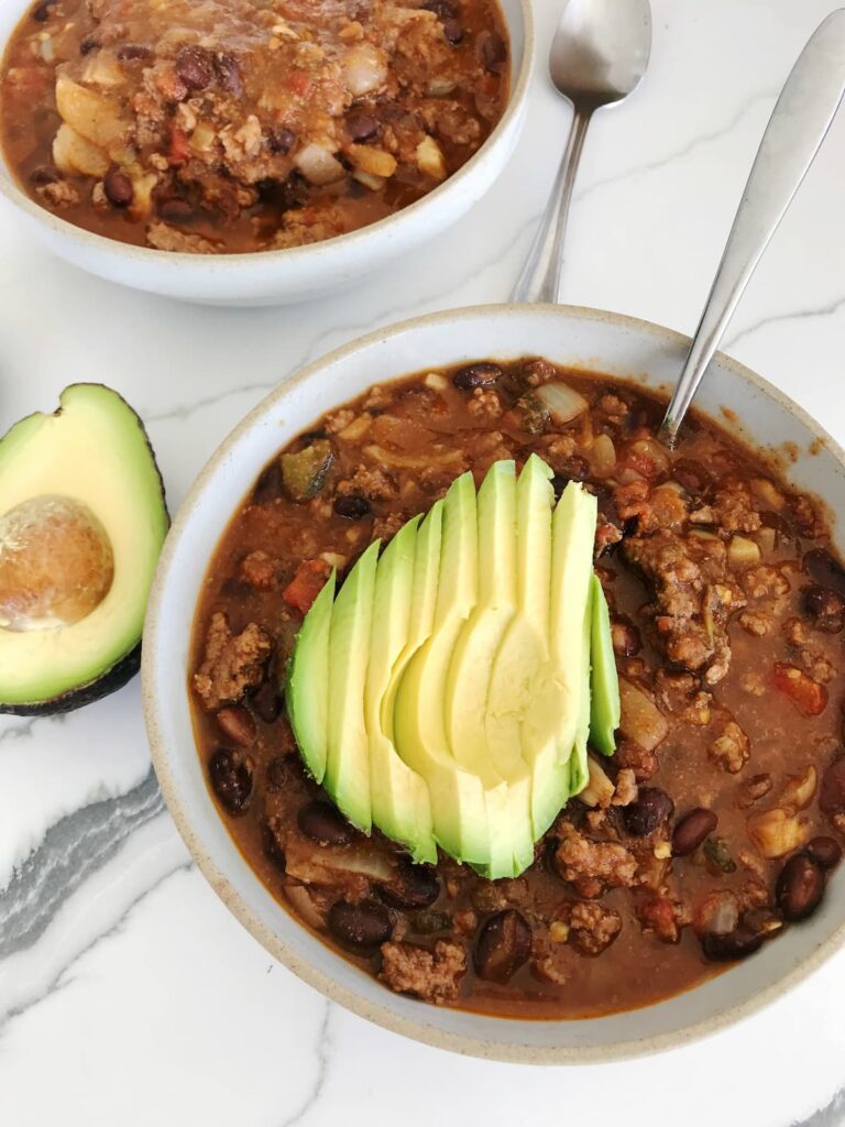 spicy bone broth chili with avocado topping