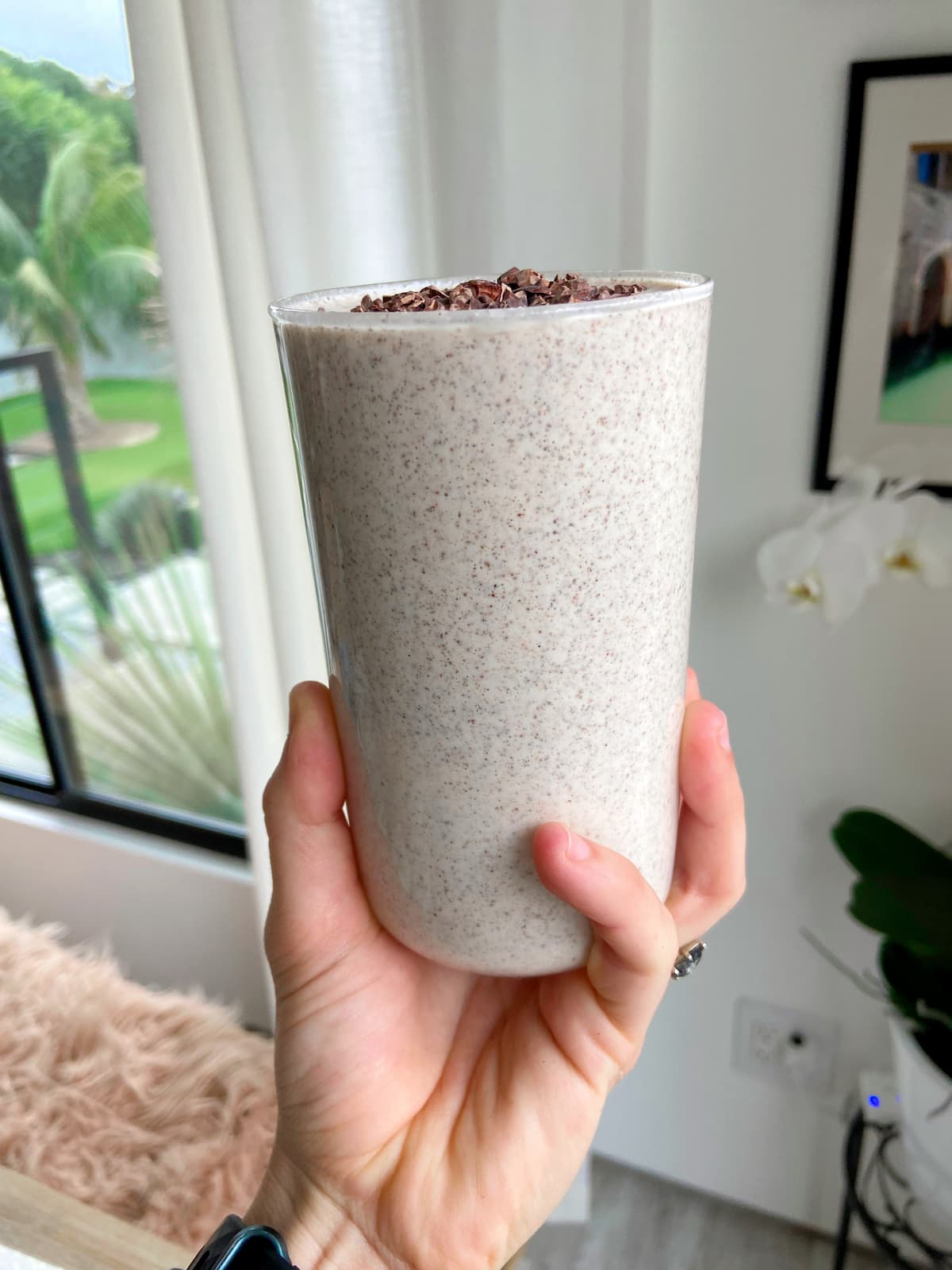 peanut butter protein smoothie with cacao nib topping