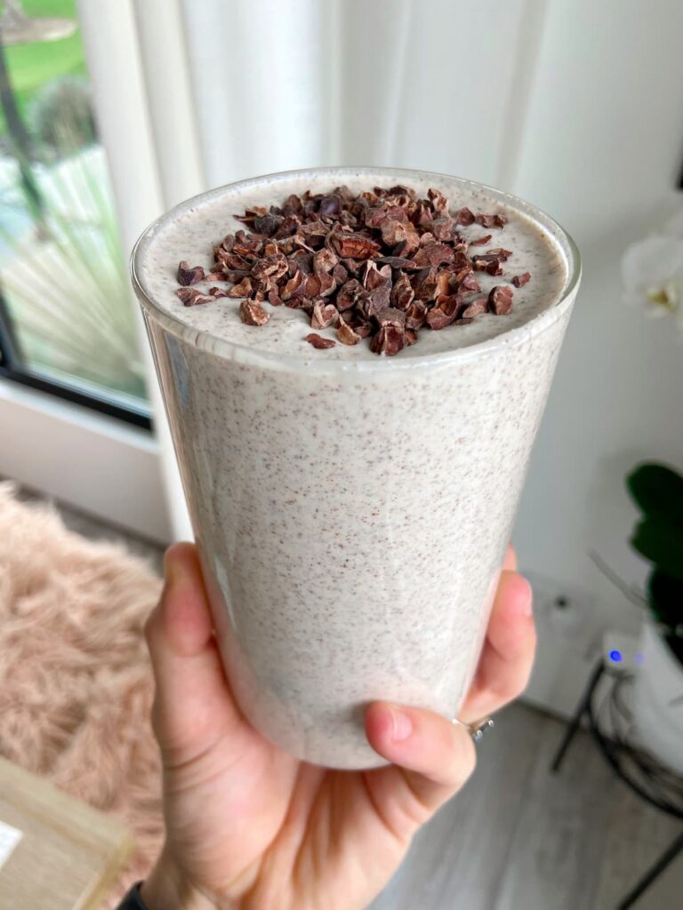 peanut butter protein smoothie with cacao nib topping