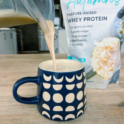 vanilla protein coffee being poured into a coffee mug