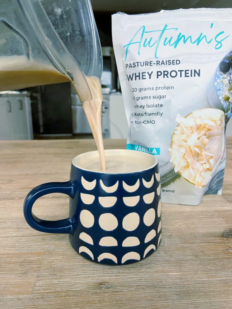 vanilla protein coffee being poured into a coffee mug