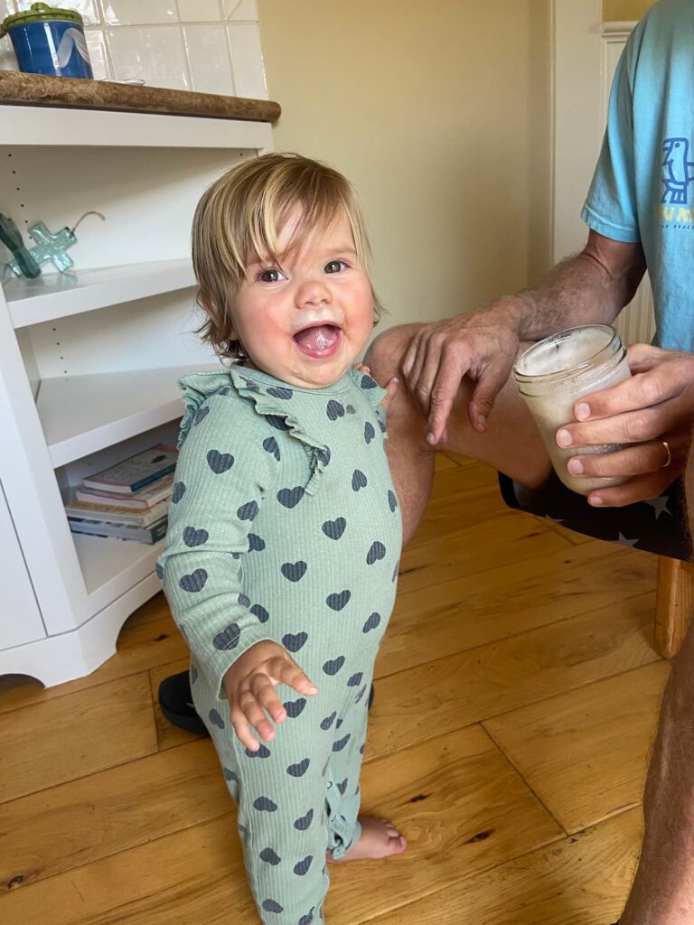toddler girl drinking a smoothie