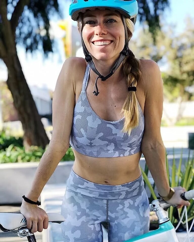 autumn bates on a bike with a helmet