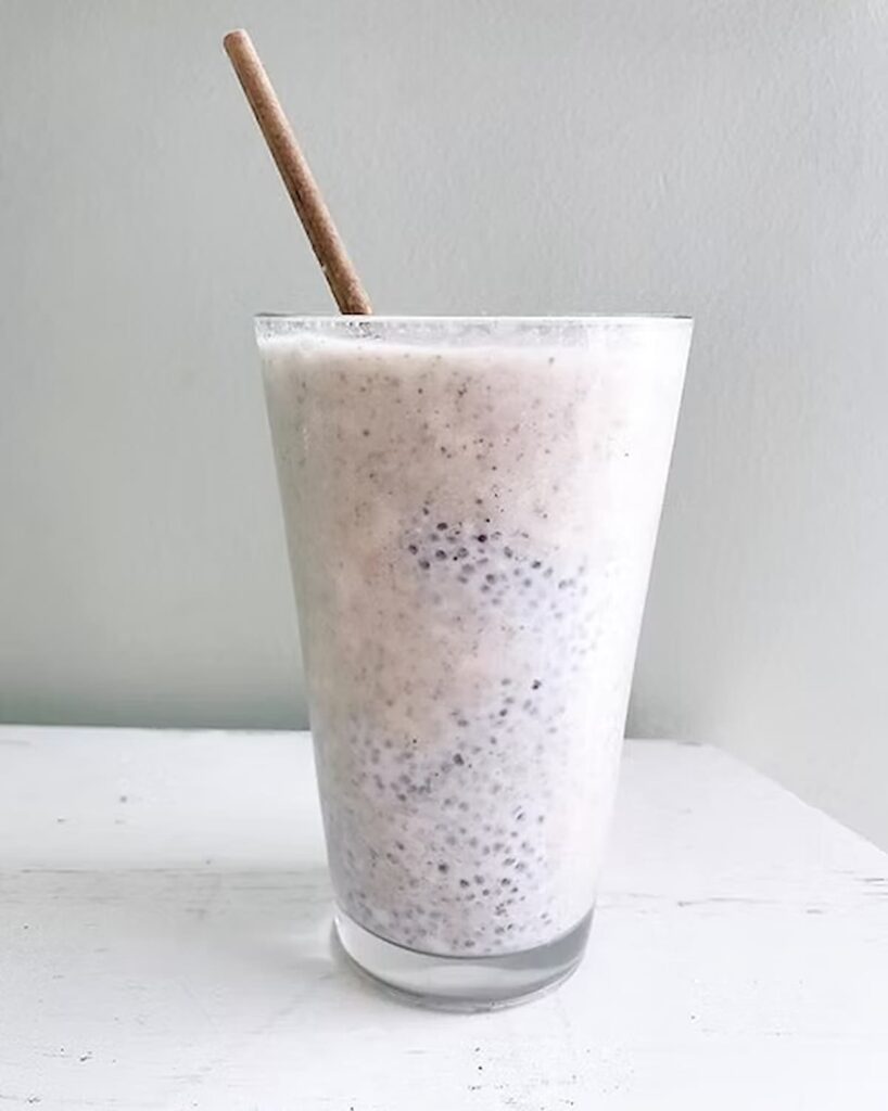smoothie in a glass with chia pudding stirred into it