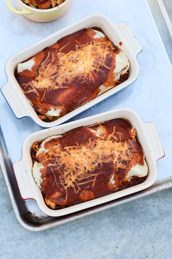 healthy chicken enchiladas in individual ceramic baking dishes