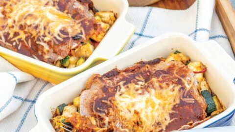 healthy chicken enchiladas in individual ceramic baking dishes