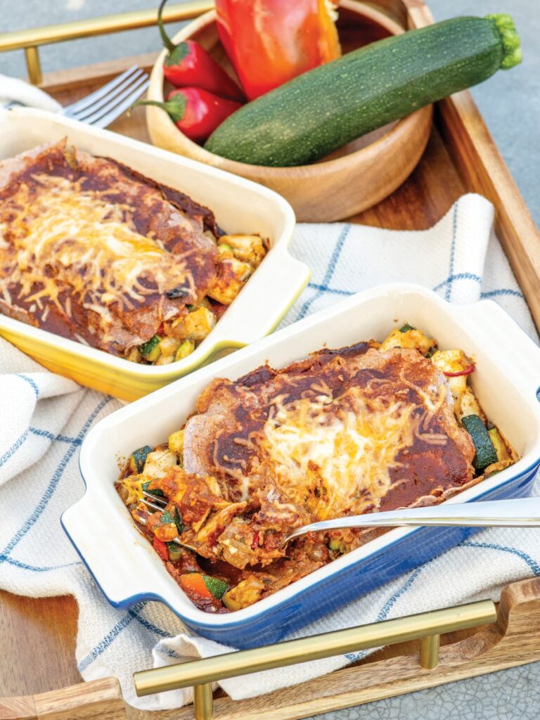 healthy chicken enchiladas in individual ceramic baking dishes