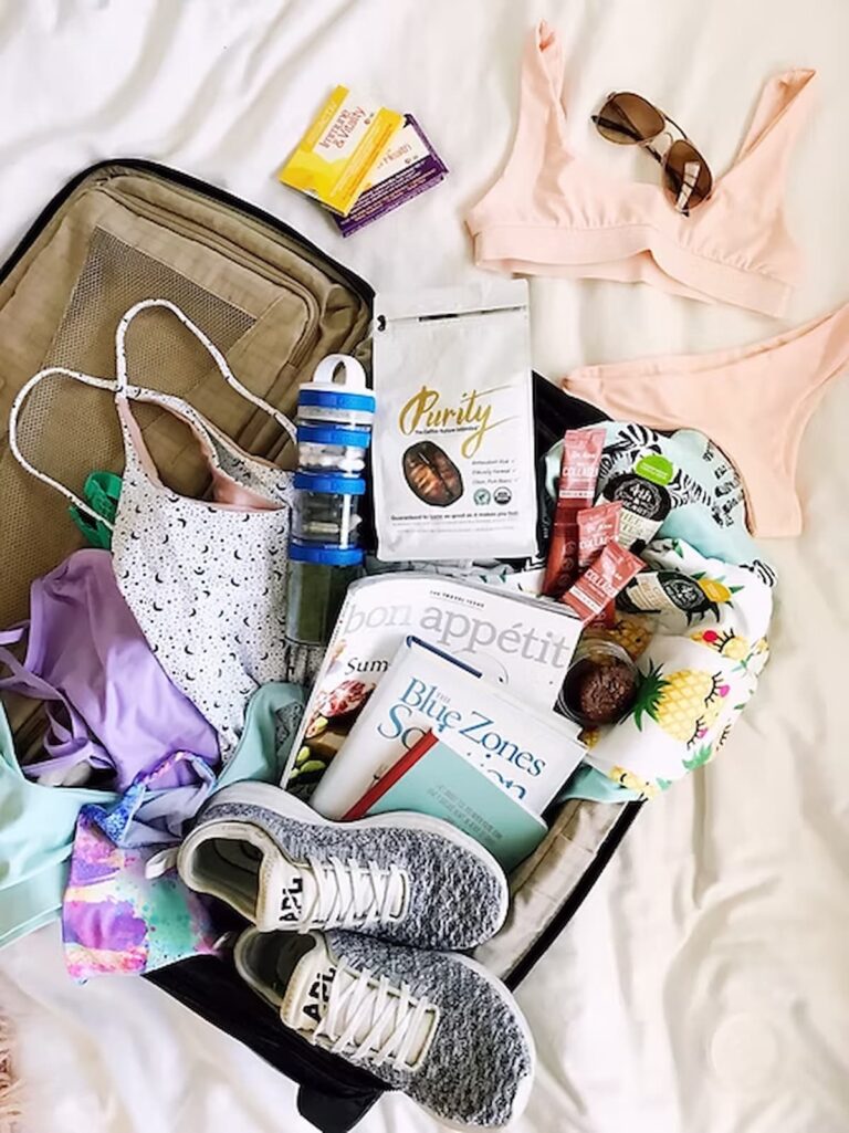 bag packed with magazines, clothes, supplements, bathing suit and coffee