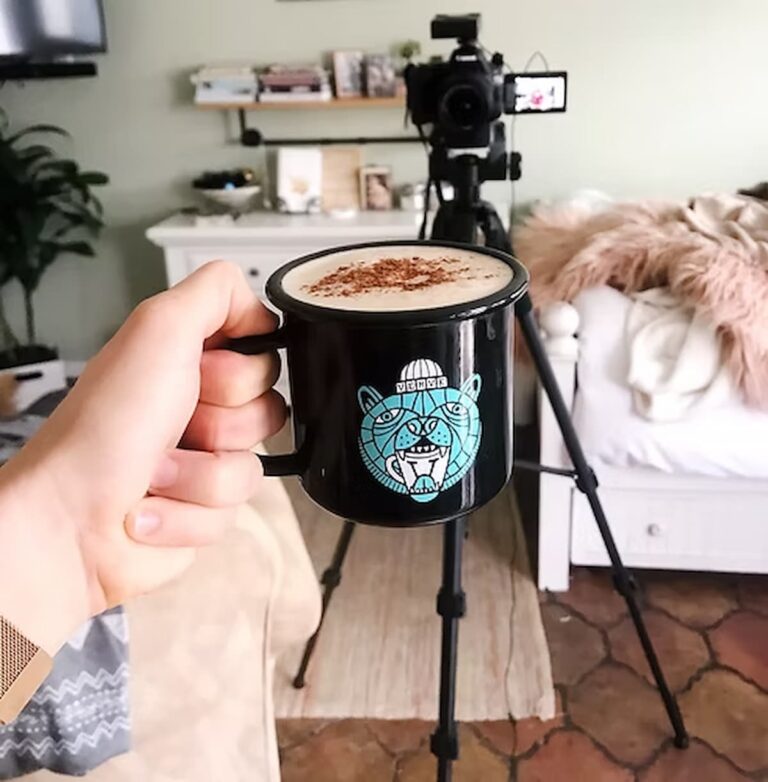 keto dirty chai latte held up in front of a camera