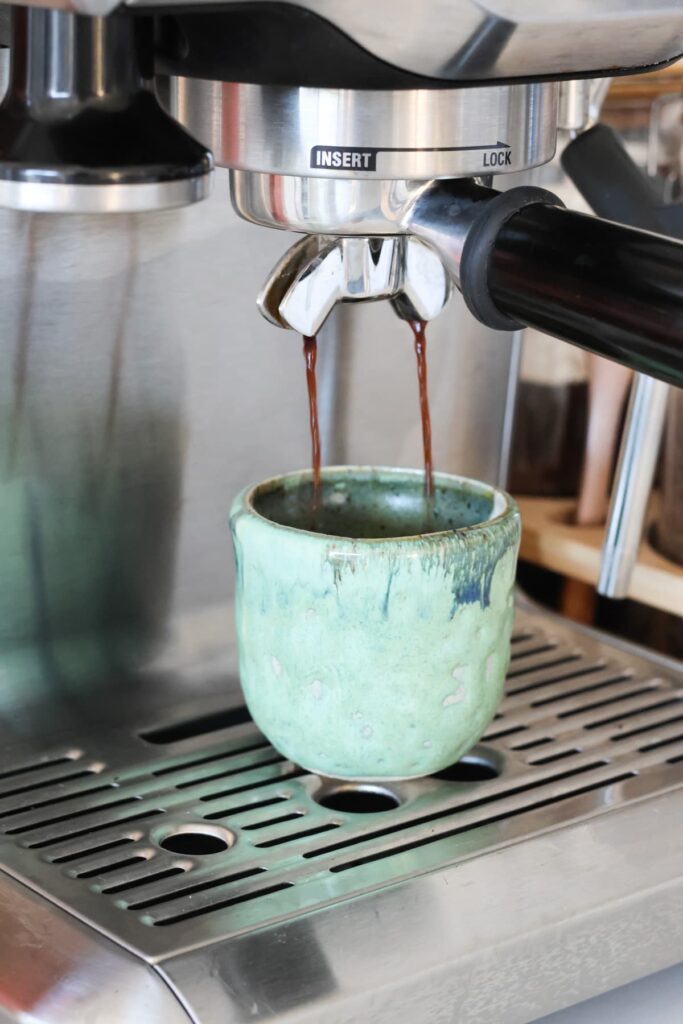 espresso shot being pulled from an espresso machine