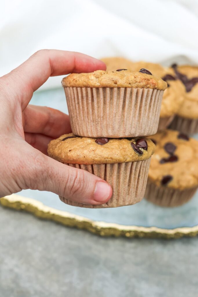 chocolate chip protein muffins held up close