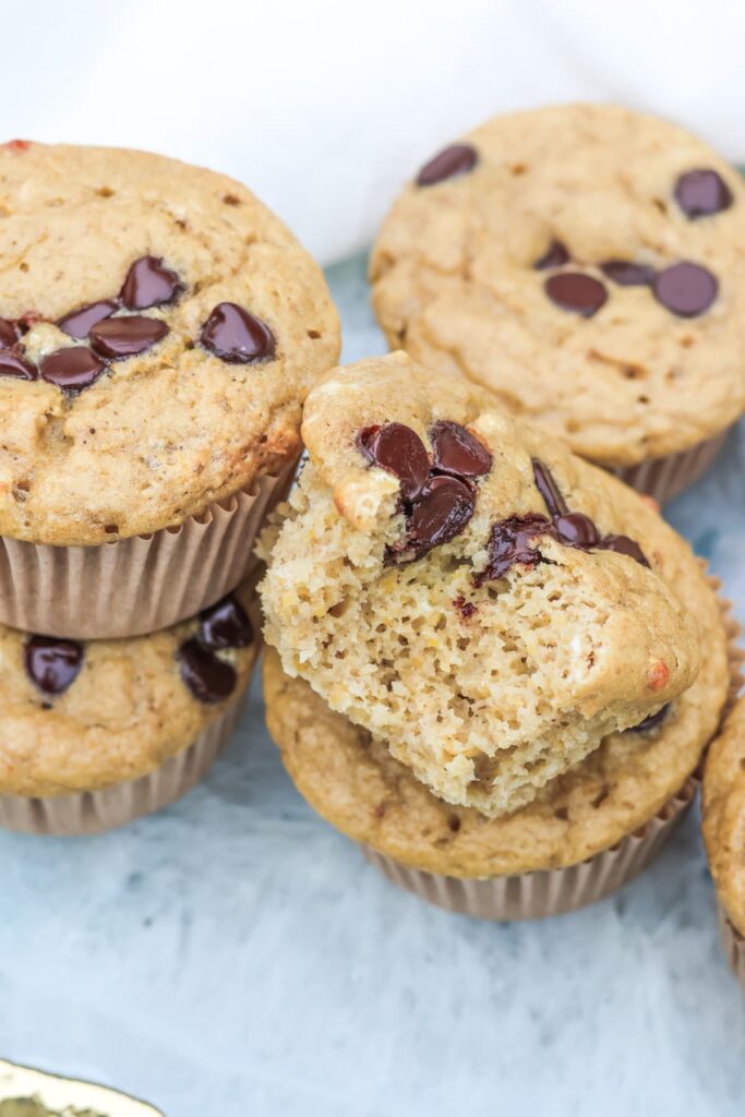 chocolate chip protein muffins close up with a biet taken out