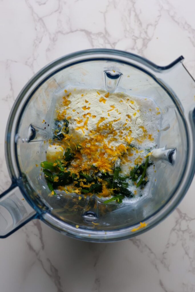 green protein smoothie ingredients in a blender