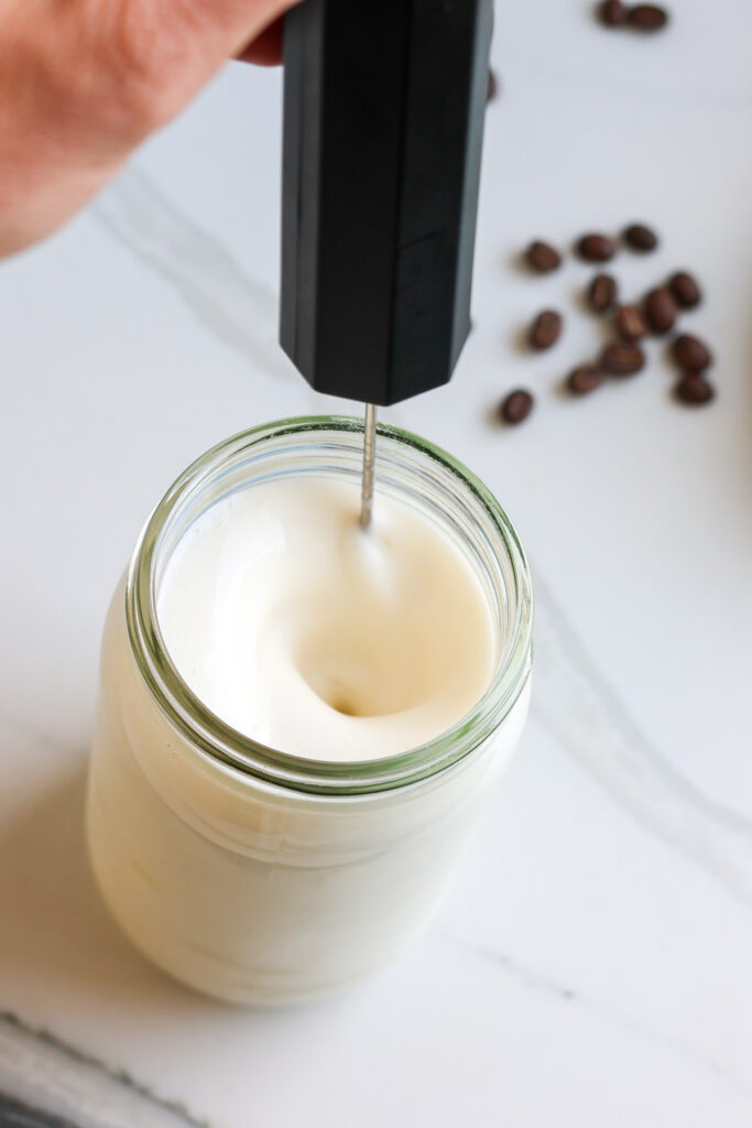 iced protein coffee being whisked