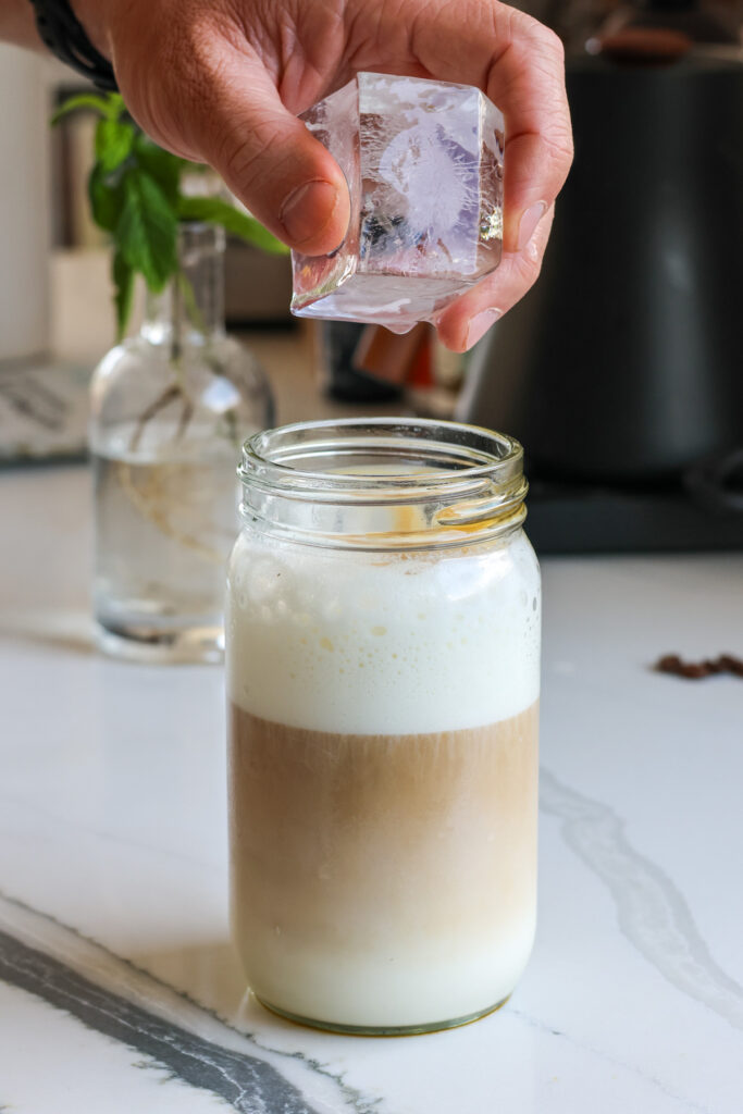adding ice to an iced protein coffee