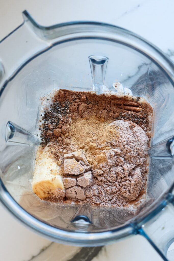 chocolate protein shake ingredients in a blender